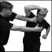 Breaking from a chokehold using a wheeling attack